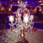 Red-and-Gold-Indian-Wedding-Centerpiece-Ideas-Gold-Candelabra-holder-Rentals-Wedding-Centerpiece